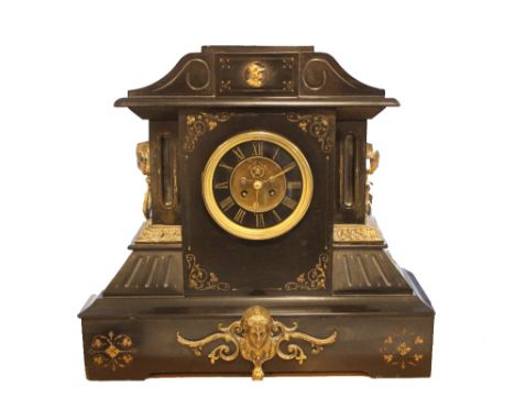 A late Victorian black marble and brass mantle clock of architectural design, eight day striking movement,  the circular blac