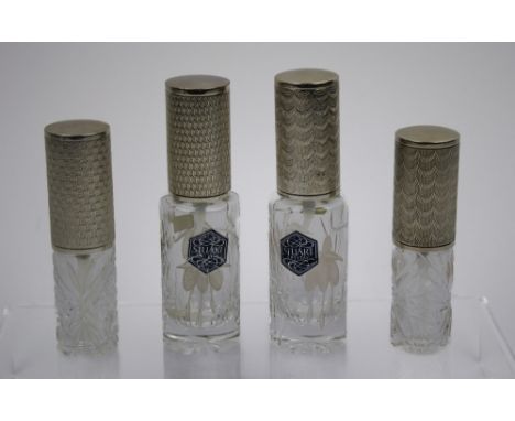 Four silver topped atomisers with cut crystal body's, all London, Markers mark for Richard Lawrence Geere.   Provenance : Gee