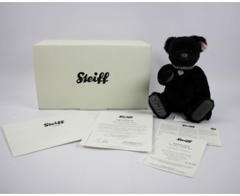 A Steiff Swarovski bear Krystina, exclusive for the Danbury Mint , in black with a growl action, elaborate heart shaped colla