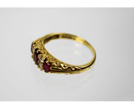 18 Carat Gold Ruby and Diamond half-hoop Ring, set with oval rubies and brilliant-cut diamonds, British hallmarks for London 