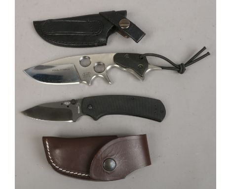 A sheathed American Phol Force hunting knife and a leather sheathed Boker folding knife.