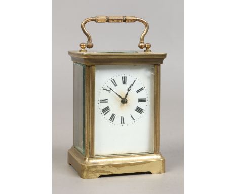 A brass cased eight day carriage clock with platform escapement. Condition Report. To be used as a guide only. Running, glass