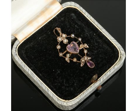 An Edwardian 9ct gold seed pearl and amethyst pendant. Condition Report. To be used as a guide only. Two pearls missing.
