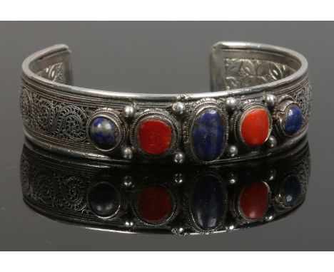 An early 20th century eastern silver stone set bangle.