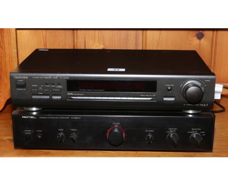 A Rotel stereo integrated amplifier along with a Technics stereo synthesizer tuner.