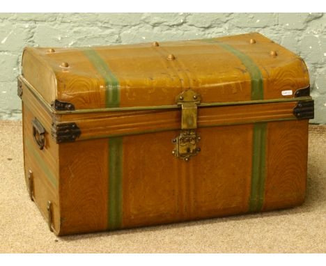 A vintage tin travel trunk.
