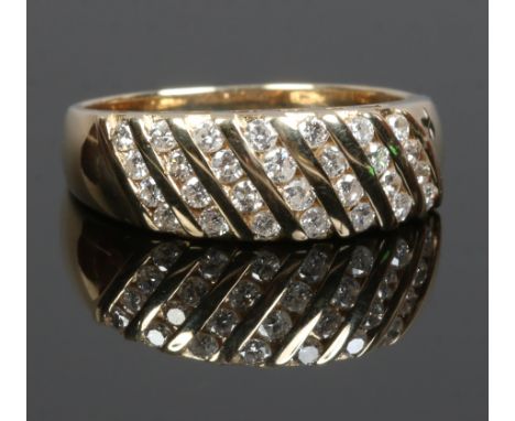 A 14ct gold diamond cluster ring with plait set shank, size M.