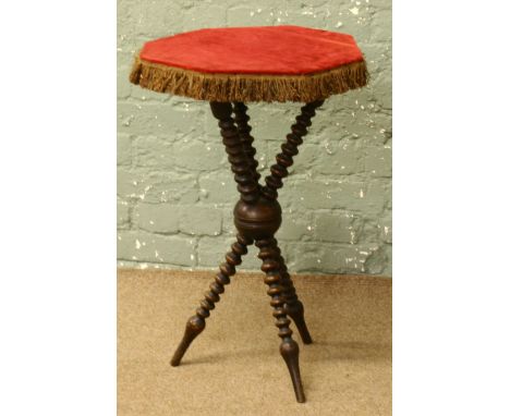 A gypsy table with bobbin turned supports. Condition Report. To be used as a guide only. Crack through middle support.