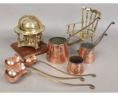 A group of collectable copper and brass alcohol measuring ladles including rum, whisky, brandy etc along with a decorative br