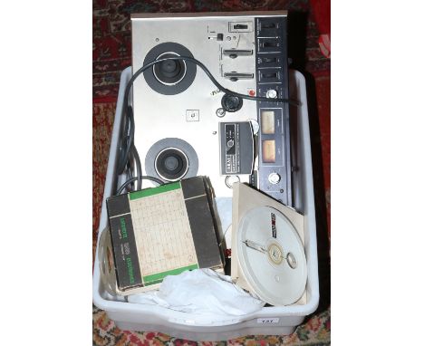 A vintage Akai 4000DS reel to reel recorder along with a quantity of tapes.