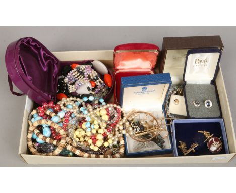 A box of costume jewellery to include gilt metal bangle, beads, earrings etc.