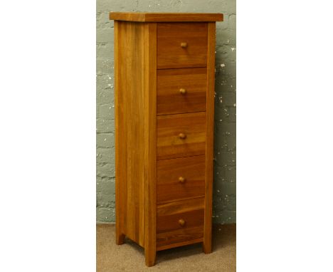 A modern light oak Wellington five drawer chest.