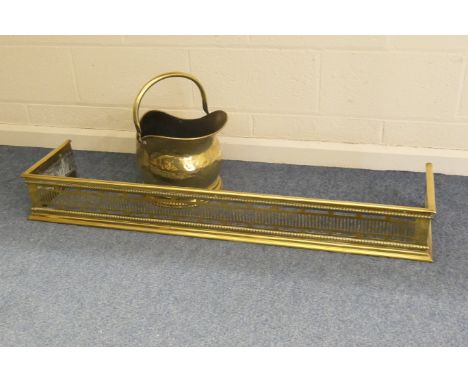 Late Victorian brass helmet shaped coal scuttle, height 27cm; also a late Victorian brass rail fender, 125cm x 29cm deep, 15.