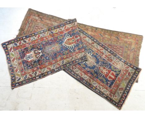 Caucasian woollen runner, late 19th Century, blue field dispersed with hooked motifs of figures, birds and animals, within a 