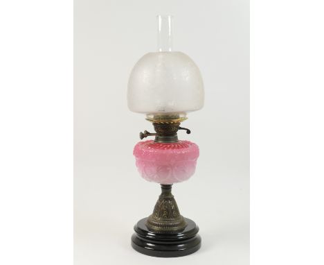 Late Victorian pedestal oil lamp, the mushroom shaped shade frosted and etched with baskets of flowers over a moulded glass t