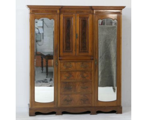 Late Victorian mahogany and inlaid inverted breakfront wardrobe, having a dentil inlaid cornice and ebony and boxwood chequer