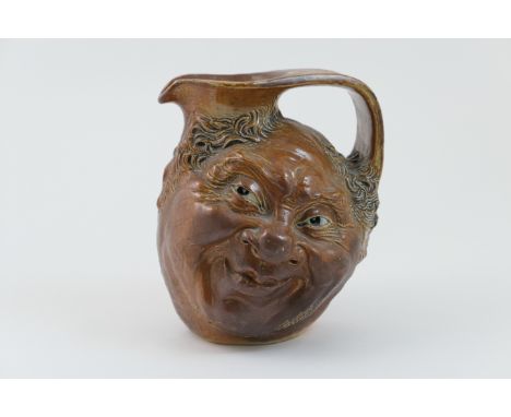 Martin Brothers face jug, dated 1903, modelled with two faces and decorated in a salt glaze, inscribed to the base 'R W Marti