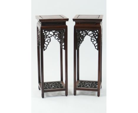 Pair of Chinese hardwood miniature jardiniere stands, 20th Century, traditional square form with pierced aprons over a pierce