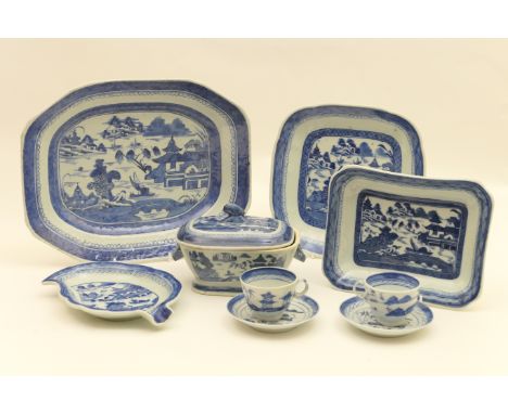 Chinese blue and white export porcelain, early 19th Century, all decorated with a lakeside pagoda landscape, comprising meat 