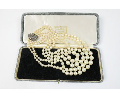 1940s simulated pearl choker necklace, by The Orient Jewel Company, London, having four strands of graduated pearls united by