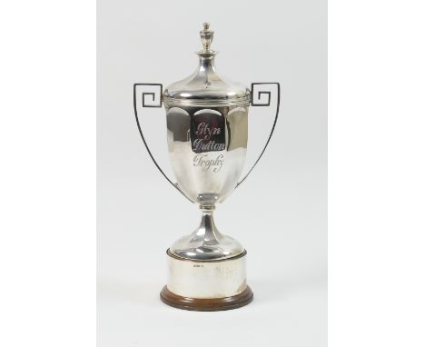 The 'Glyn Dutton' silver trophy, by Walker &amp; Hall, Sheffield 1926, having a cover with finial over a twin handled octagon