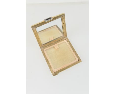 George V 9ct gold compact, London 1934, square form with engine turned decoration, with a black onyx and diamond clasp, 6.5cm