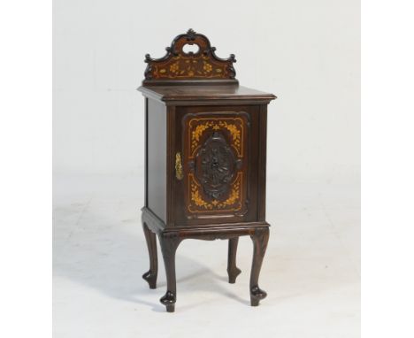 Quality Victorian carved mahogany and inlaid pot cupboard, circa 1890, having a back carved with C-scrolls and inlaid with fl