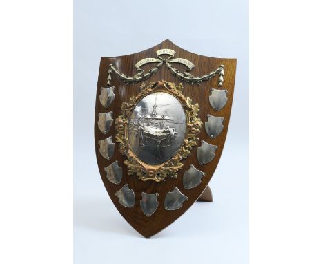 'Le Mond Challenge Shield for Billiards', the oak shield centred with a silver plated bas-relief billiard room bordered with 