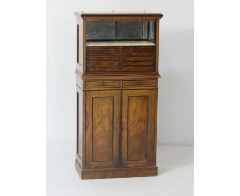 Late Victorian walnut dentistry cabinet, circa 1890, having a tambour front opening to a marble slab with three quarter mirro