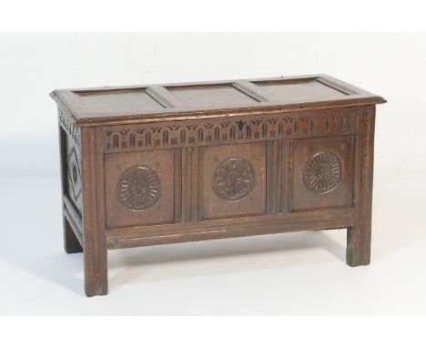 Oak joined coffer, circa 1680-1700, having three recessed panel top with original loop hinges, over a thumb carved frieze and