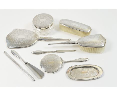 Birks (American) sterling silver vanity set, circa 1950-60, comprising shaped hand mirror, concave mirror, hairbrush, clothes