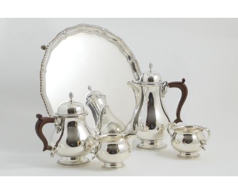 Modern silver five piece tea service, by Barker Ellis Silver Company, Birmingham 1964, comprising serving tray of shaped circ