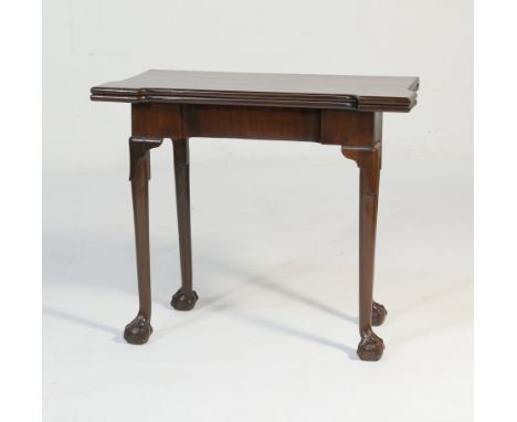 George III mahogany folding card table, circa 1770, the top folding over a single gate to the rear, opening to reveal candle 