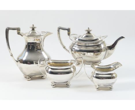 George V four piece silver tea service, maker HA, Sheffield 1920/21, plain bombe shape with reeded rim and raised on ball fee