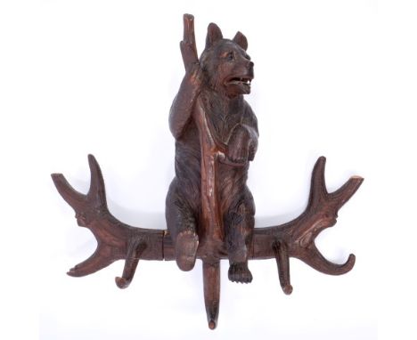 Good late 19th century Black Forest carved coat rack finely carved as a bear climbing amongst naturalistic branches, 59cm hig