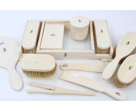 Early 20th century ivory dressing table set - comprising brushes, mirror, boxes, comb, etc, all with inlaid gilt metal initia