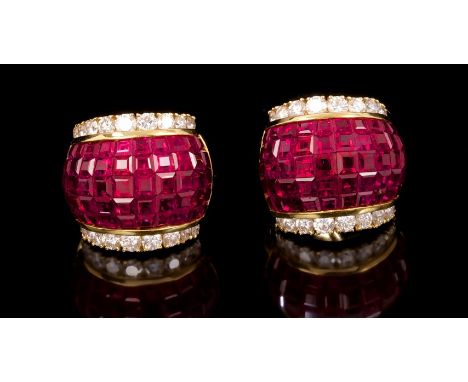 Pair ruby and diamond earrings, probably Sabbadini, each designed as a wide band of bombe form with invisibly set calibre cut