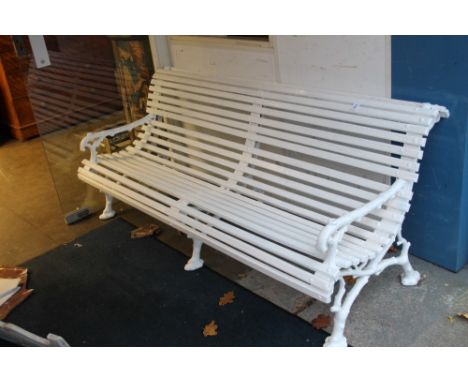 19th century Coalbrookdale-style white painted cast iron bench with wooden slats, the frame simulating knotted wood, having s