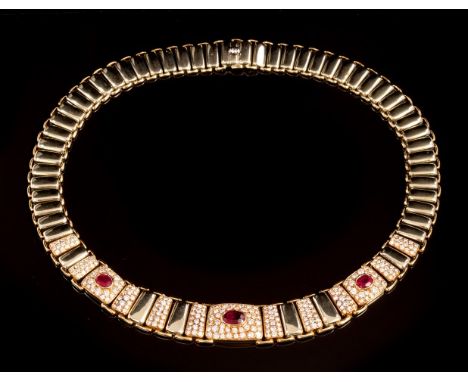 Gold ruby and diamond necklace, the graduated two-colour gold collar with articulated links and three plaques centred with an