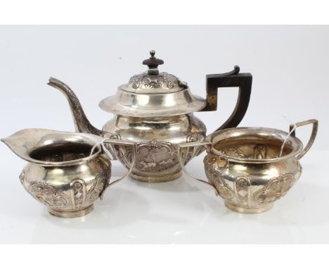 Late 19th / early 20th century Indian white metal three piece tea set - comprising teapot of compressed baluster form, with i
