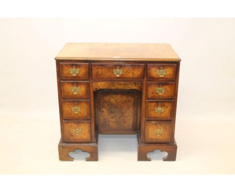 George I-style walnut crossbanded and feather-banded knee-hole dressing table, the moulded top with re-entrant angles and hav