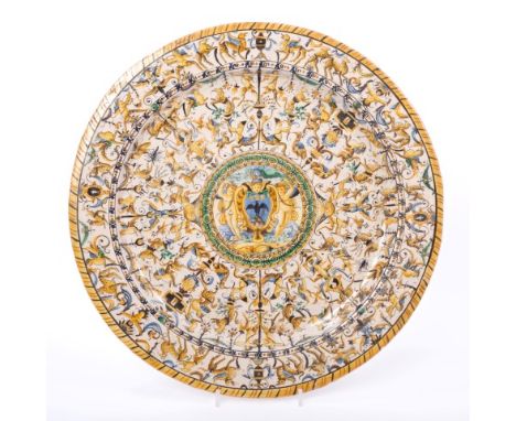 19th century Italian Majolica charger boldly painted with central Raven coat of arms with cherub supporters, on mystical beas