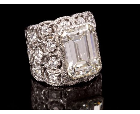 Fine diamond cocktail ring by Mario Buccellati, the impressive emerald cut diamond weighing 8.50 carats, colour grade J, clar