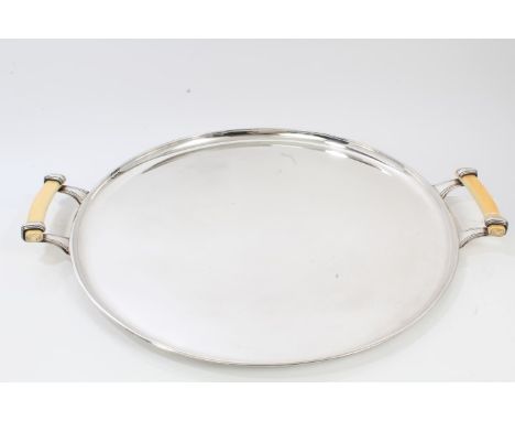 Large 1930s two-handled silver Art Deco-style tray of circular form, with turned lip rim, scroll mounted ivory handle (Sheffi