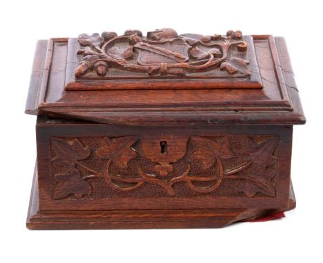 Victorian carved oak casket of Shakespearian interest, the hinged stepped cover relief carved with Shakespeare's coat of arms