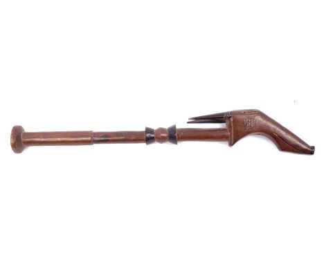 19th century West African wooden axe handle with horned animal-head mount and turned decoration