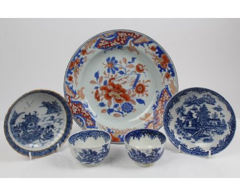 18th century Worcester blue and white tea bowl and saucer with printed chinoiserie landscape decoration and matching tea bowl