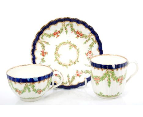 18th century Worcester fluted teabowl, coffee cup and saucer with painted floral garlands, circa 1775 - blue 'W' marks. Prove