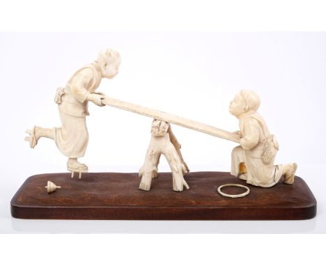 Fine late 19th / early 20th century Japanese Tokyo School carved ivory okimono depicting two children playing on a crudely co