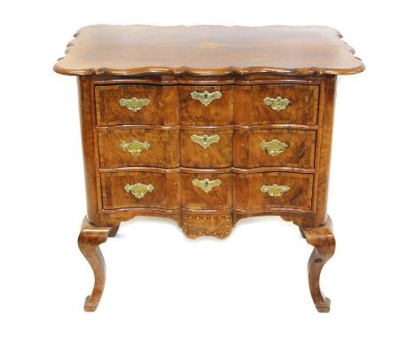 18th century and later Dutch walnut crossbanded and marquetry inlaid commode of arc-en-arbelette form, the shaped projecting 